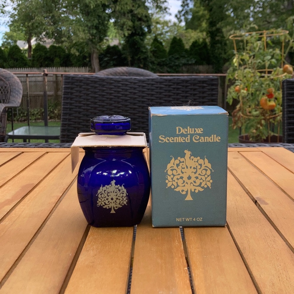 Vintage scented candle in blue glass jar